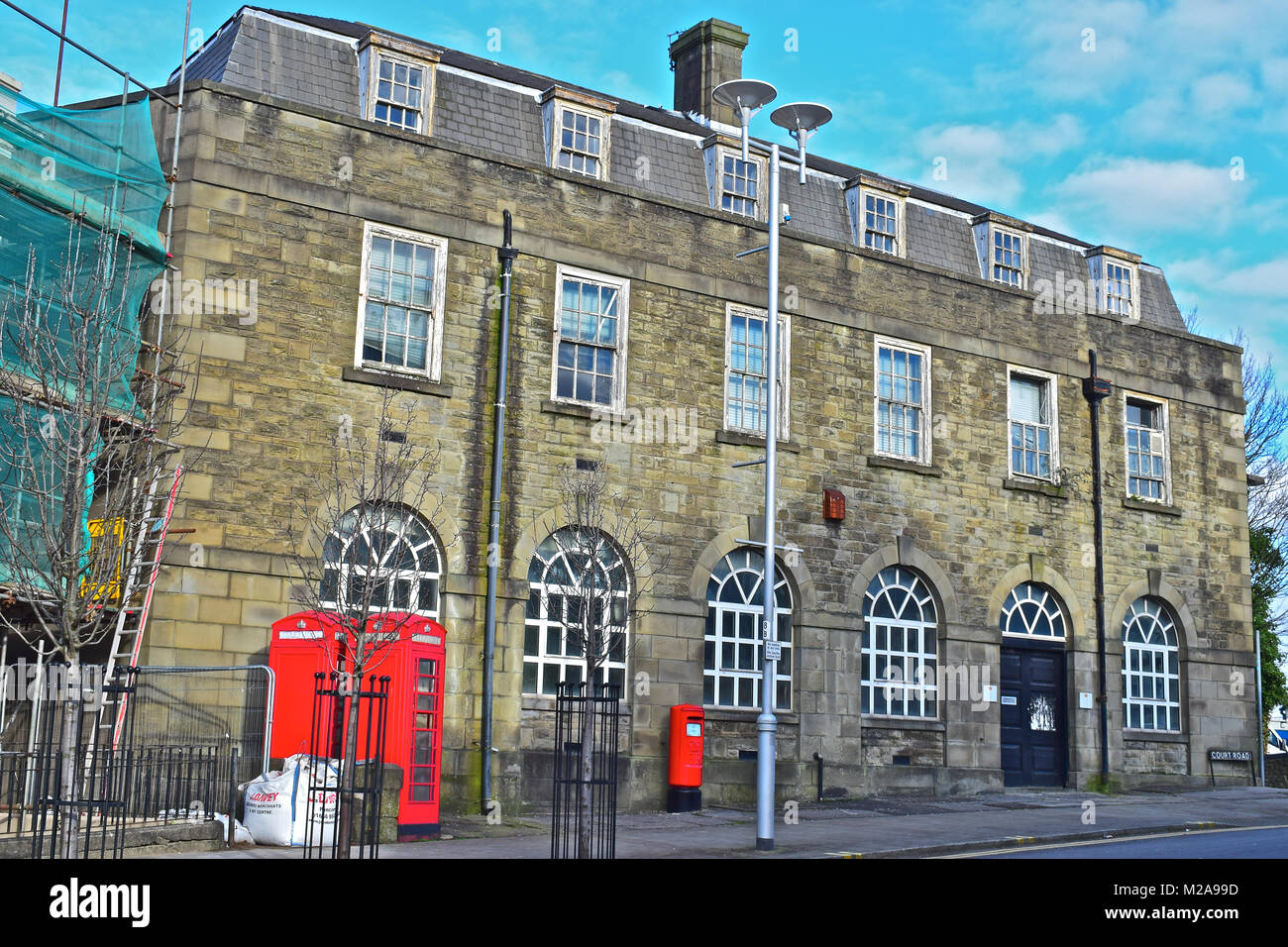 Former GPO Head Office/sorting office, Bridgend,S.Wales.The pair of red phone boxes are Grade II Listed. The bldg is listed as 'Of Local Importance'. Stock Photo