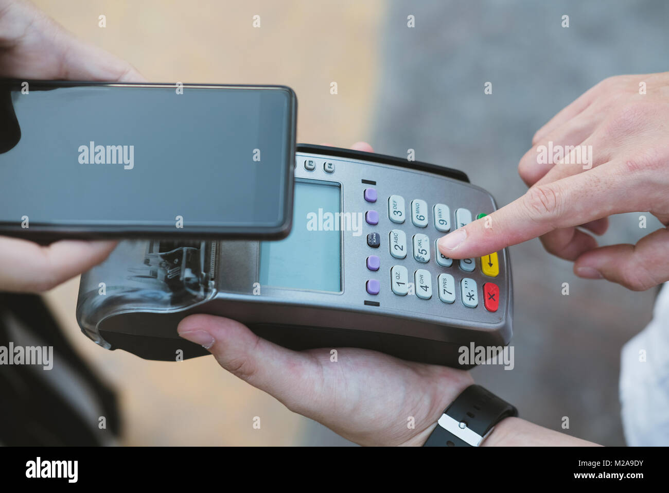 woman use smartphone to make mobile payment with electronic reader ...