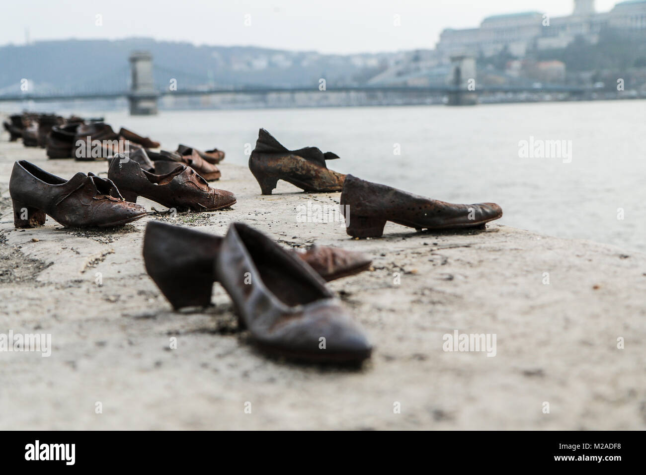 A memorial remembering the murder of the Jews during second world war. Standing by the river Danube in Budapest. Stock Photo