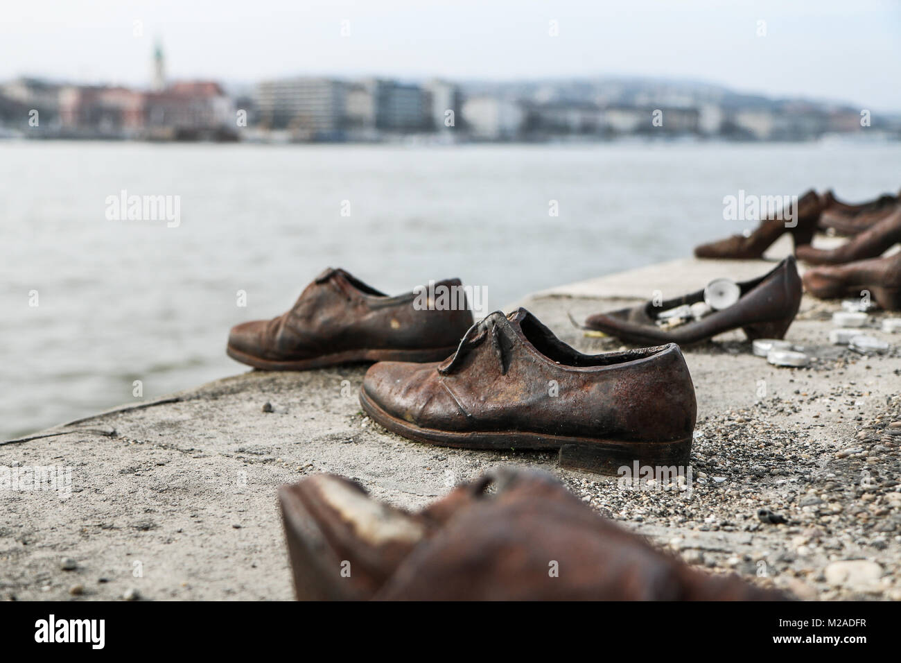 A memorial remembering the murder of the Jews during second world war. Standing by the river Danube in Budapest. Stock Photo