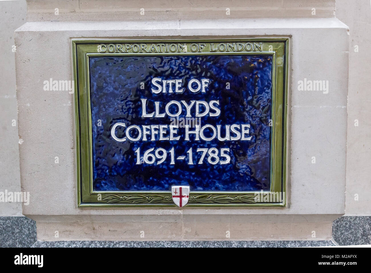 An English heritage blue plaque on Lombard St, London commemorating the location of the former Lloyds Coffee House between 1691 and 1785.  Lombard St  Stock Photo