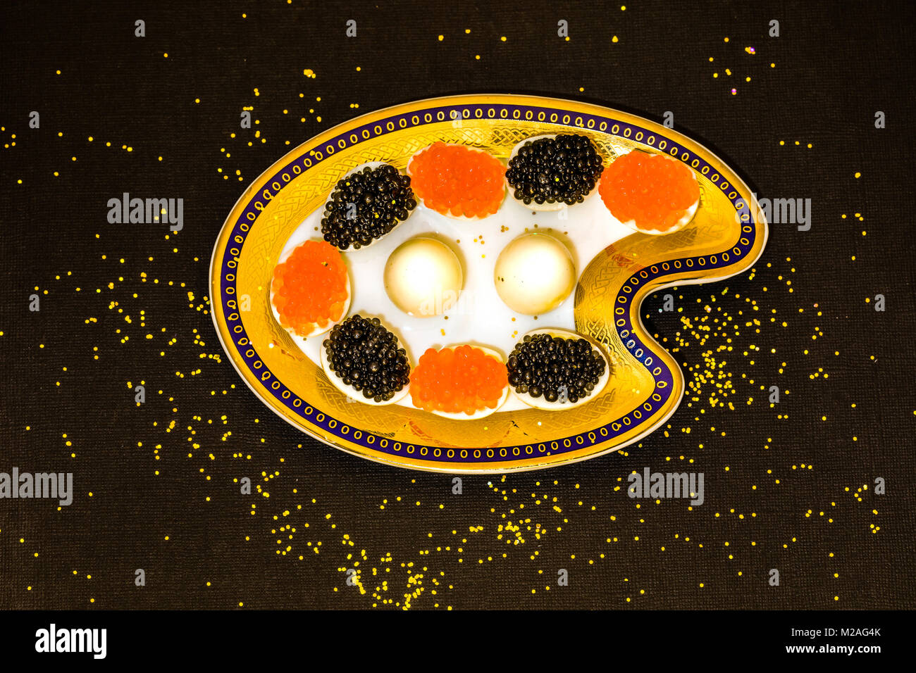 Quail eggs with caviar Stock Photo - Alamy