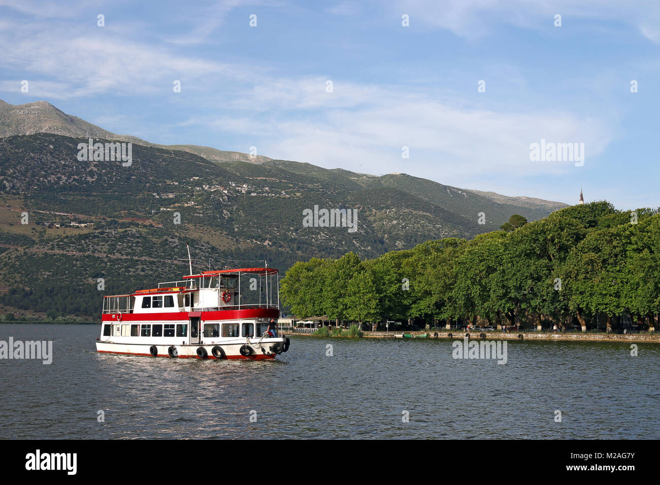 the ship sails on the lake Ioannina Greece Stock Photo