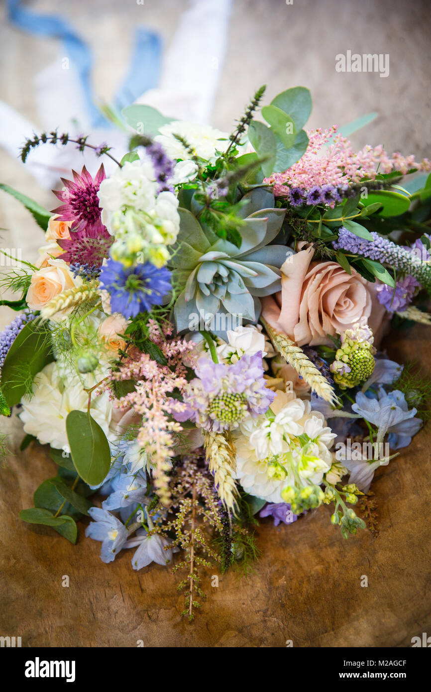 Colourful floral bouquet on wooden table, close up Stock Photo