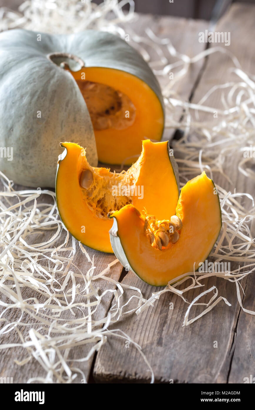 Ripe pumpkin on the wooden background Stock Photo - Alamy