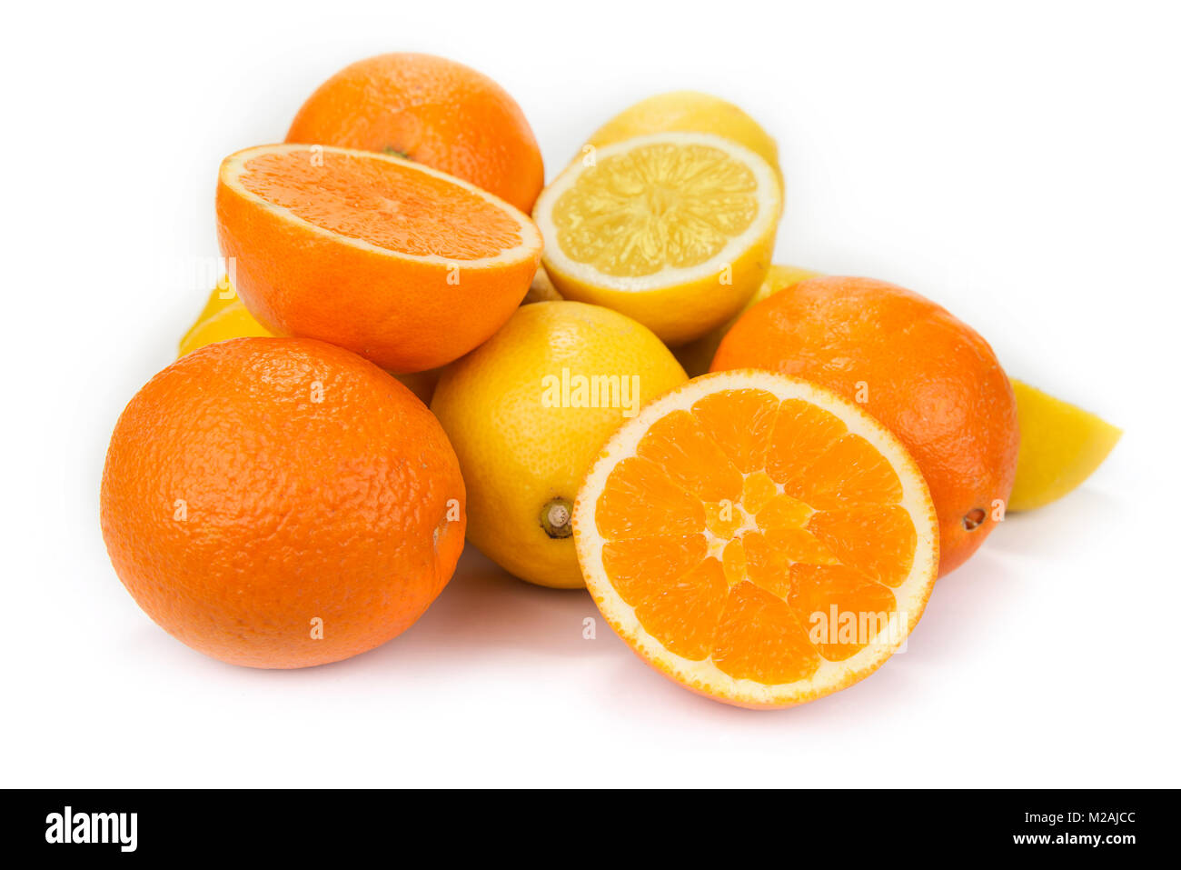 Fresh oranges and lemons on the white background Stock Photo