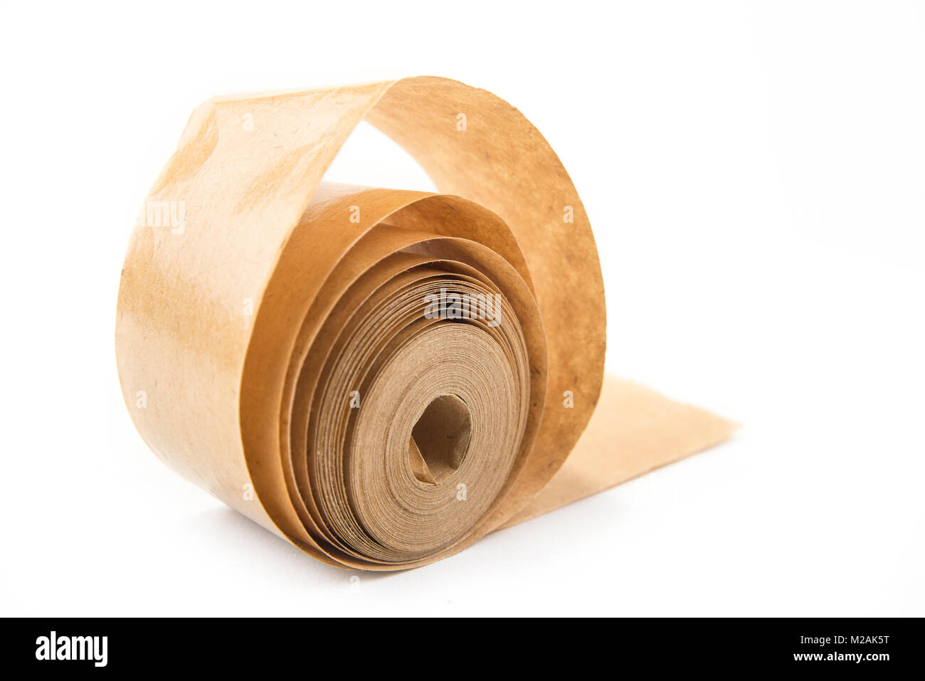 Brown roll of old paper tape for office on the white Stock Photo - Alamy