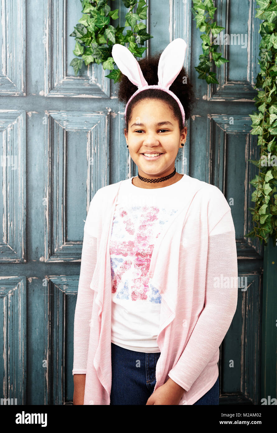 Portrait of african girl with pink bunny ears Stock Photo
