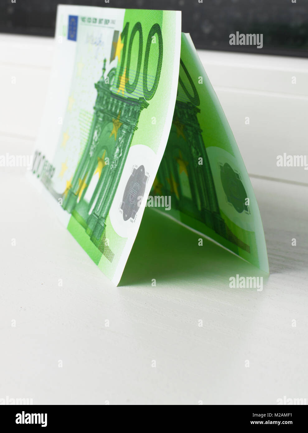 origami green house from 100 euros money bankntes Stock Photo - Alamy