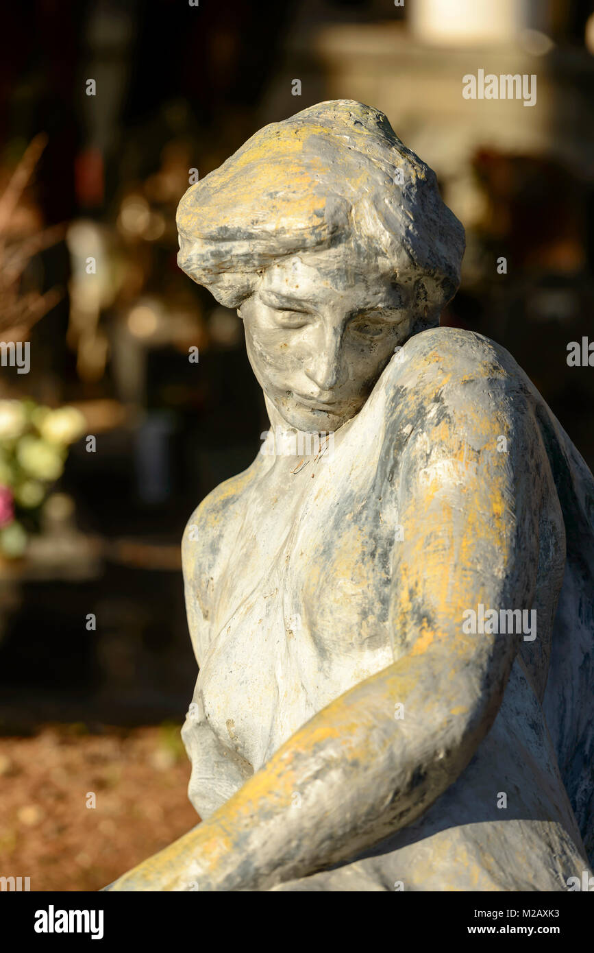 bronze sculpture of woman at historical monumental Staglieno Cemetery