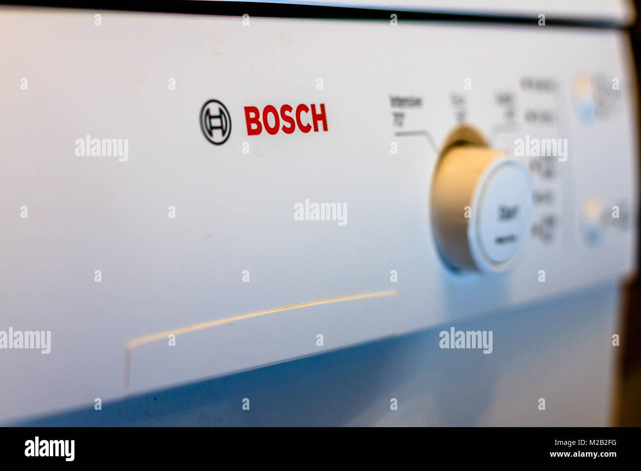 Front dials on a domestic household Bosch dishwasher appliance. February 2018. Stock Photo