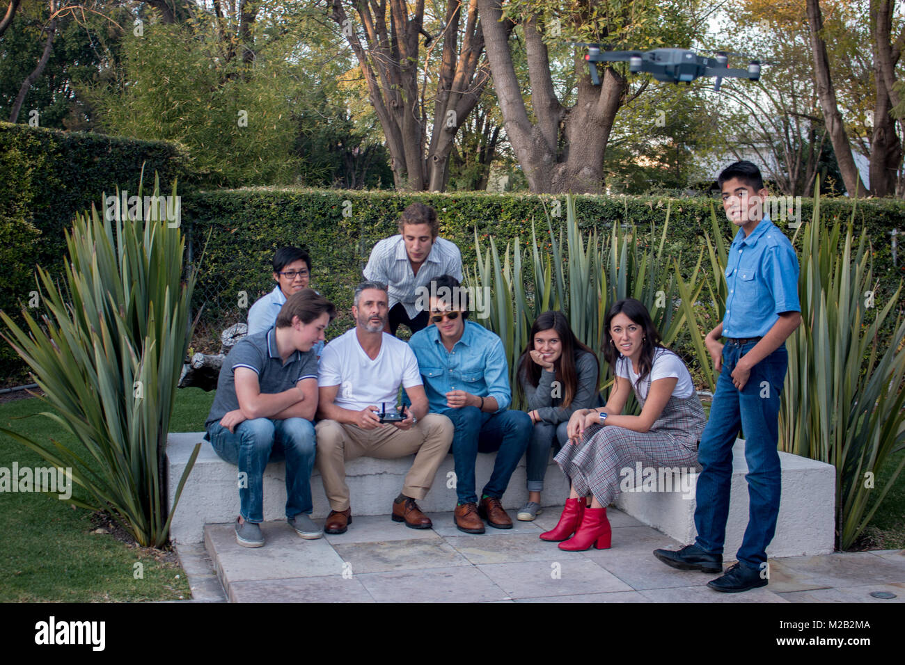 A family having fun playing with a modern drone Stock Photo - Alamy