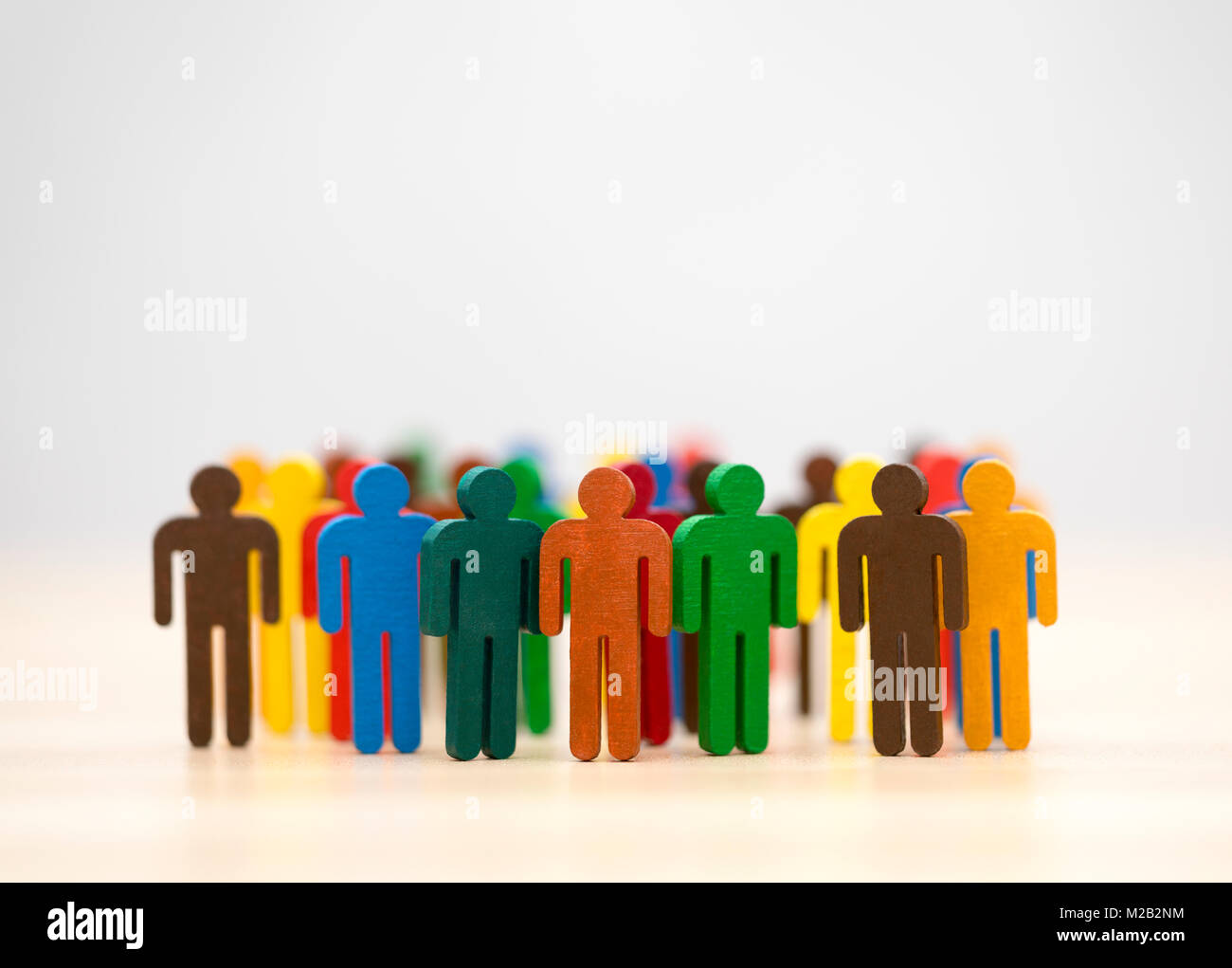 Colorful painted group of people figures Stock Photo