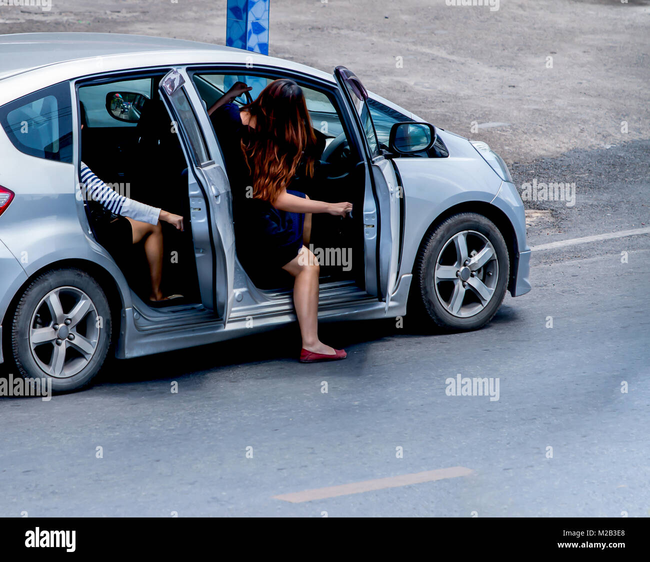 Close up woman getting into the car for drive a car Stock Photo - Alamy