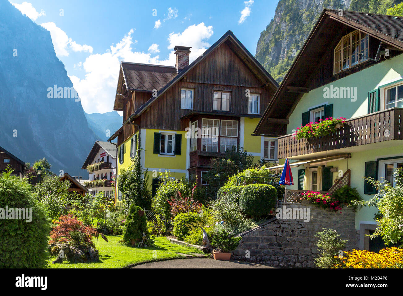 HALLSTATT, AUSTRIA - SEPTEMBER 14, 2016 : Hallstatt village with historic mountain houses around, among Alp Mountains in Salzkammergut area. Stock Photo