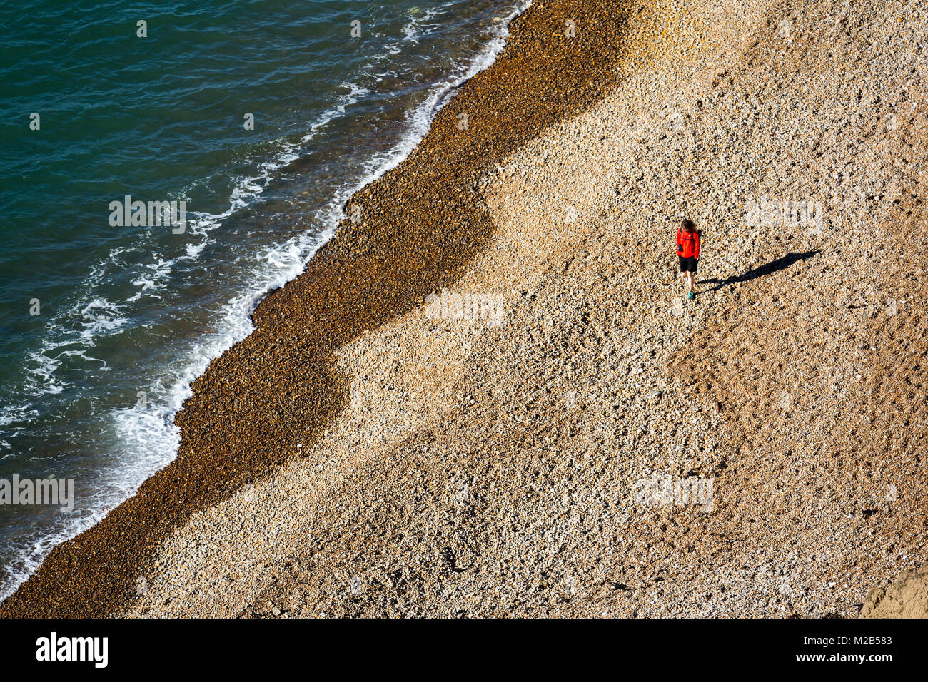 Person walking on beach, Alum Bay, Isle of Wight, UK Stock Photo