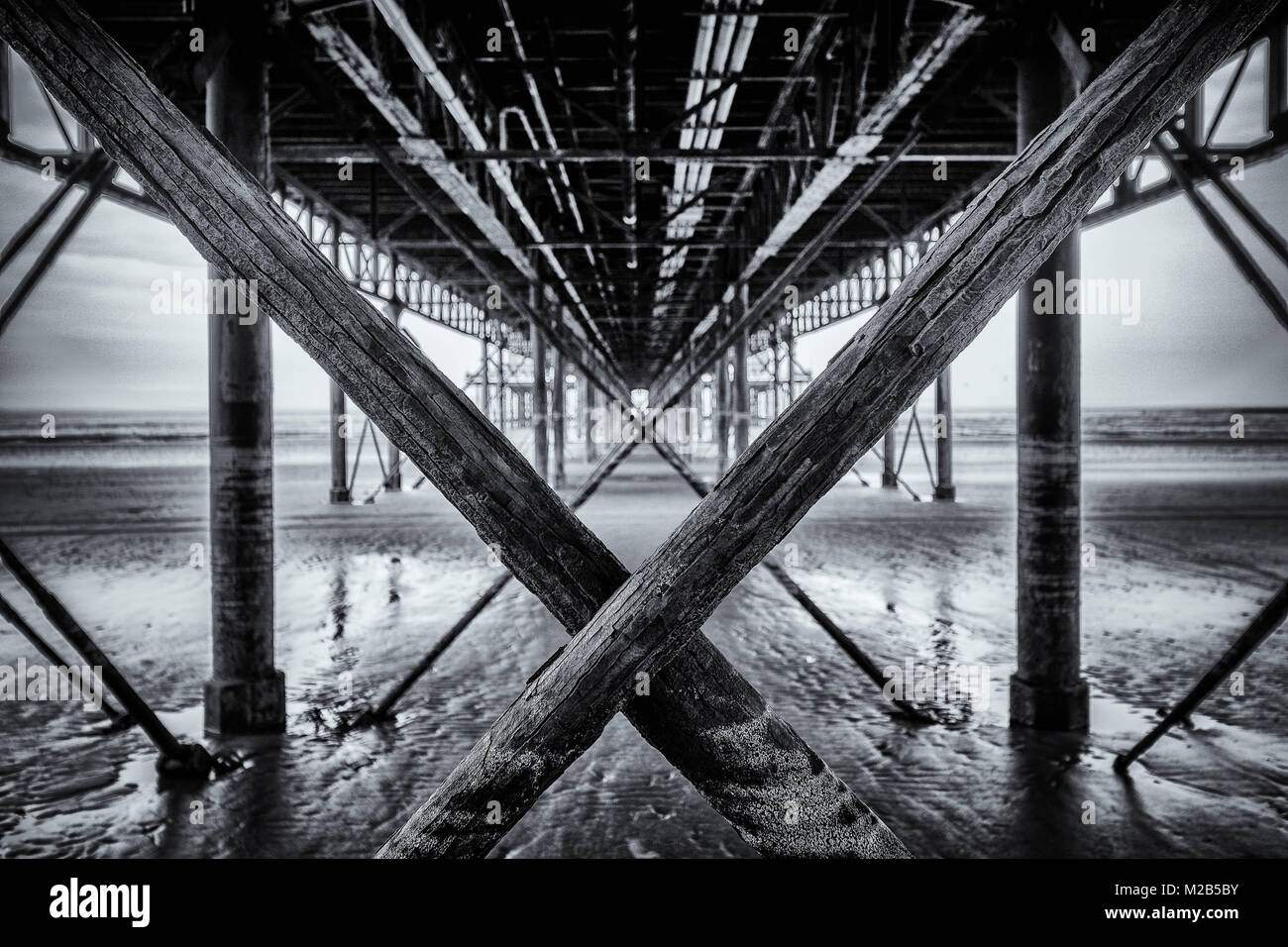 Black and white image shot under the pier in Weston Super Mare, Somerset UK Stock Photo