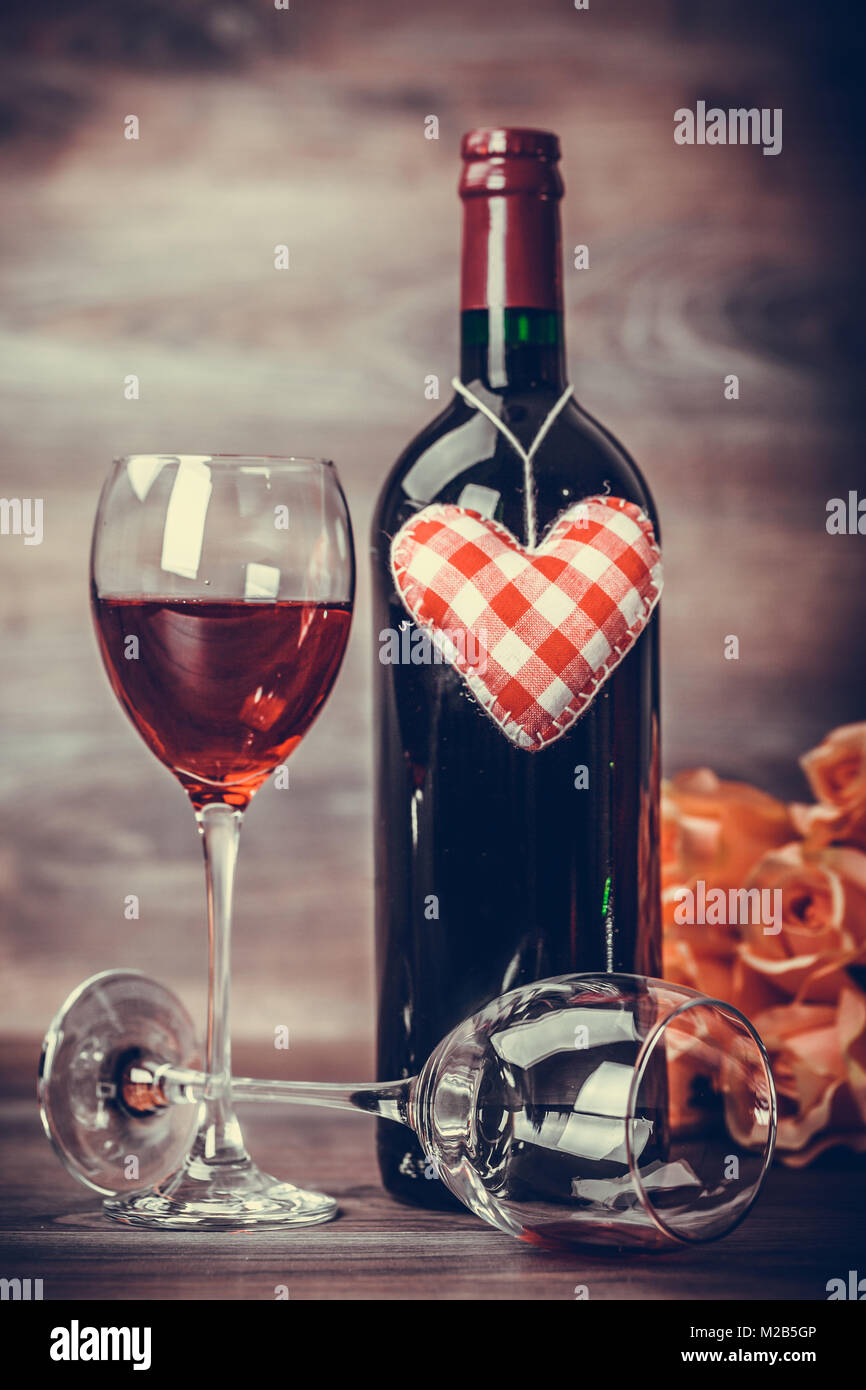 Red Wine Bottle Two Glasses Of Wine Roses With Decoration By Red
