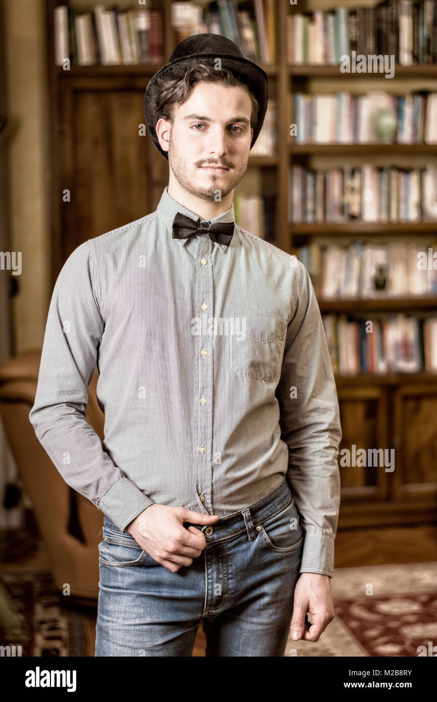 Attractive young man wearing top hat and bow tie Stock Photo Alamy