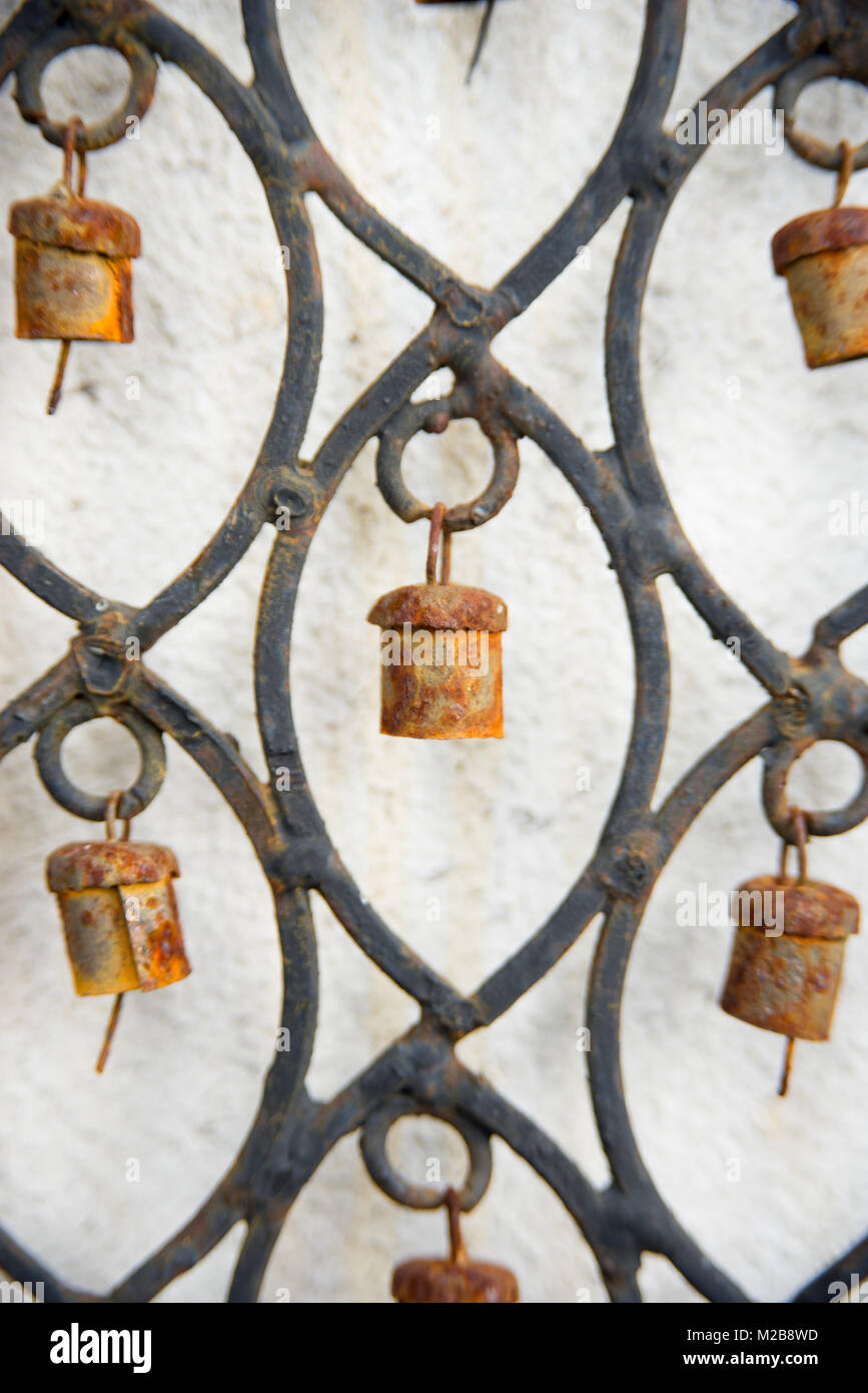 Close up of rusty bells on a hand made metal wind chime Stock Photo