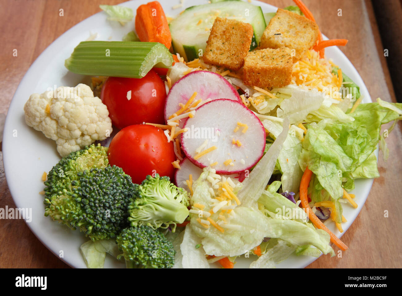 plain green salad side dish with a variety vegetables close up Stock