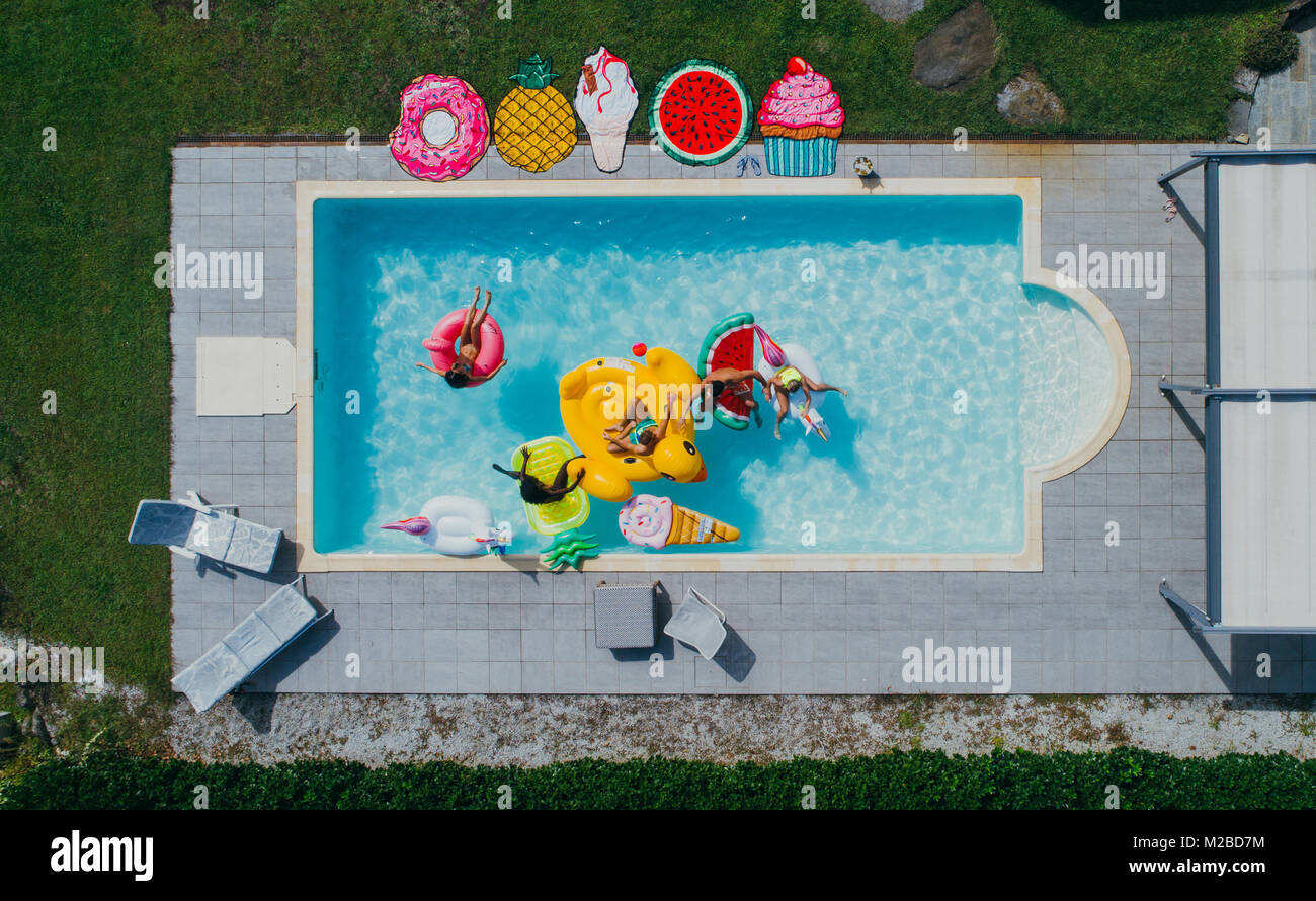 group of friends having fun in the swimming pool Stock Photo - Alamy