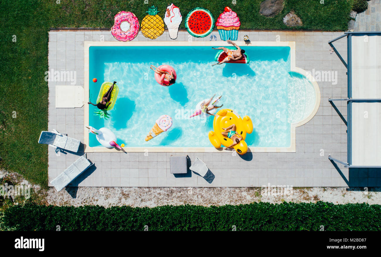 group of friends having fun in the swimming pool Stock Photo - Alamy