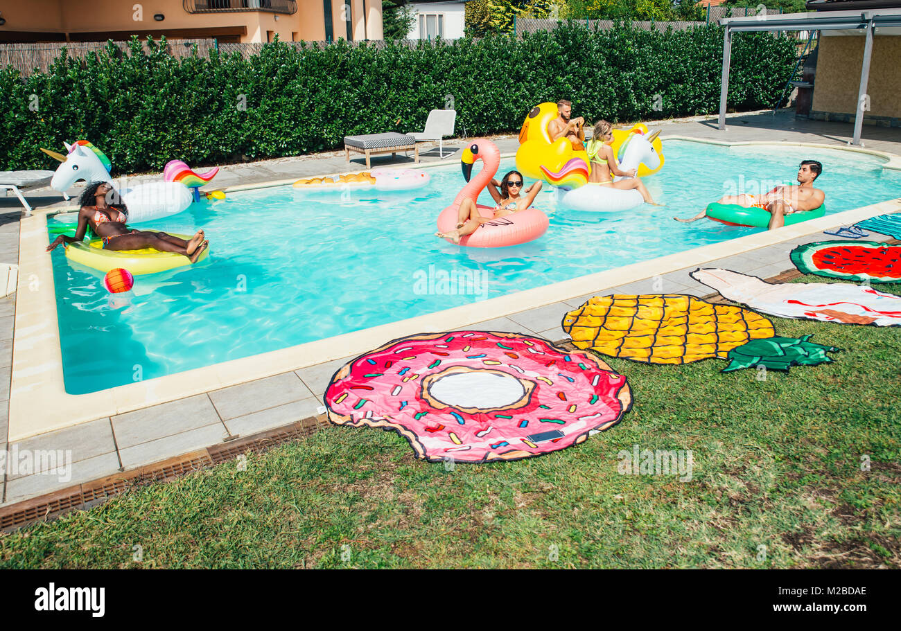 group of friends having fun in the swimming pool Stock Photo - Alamy