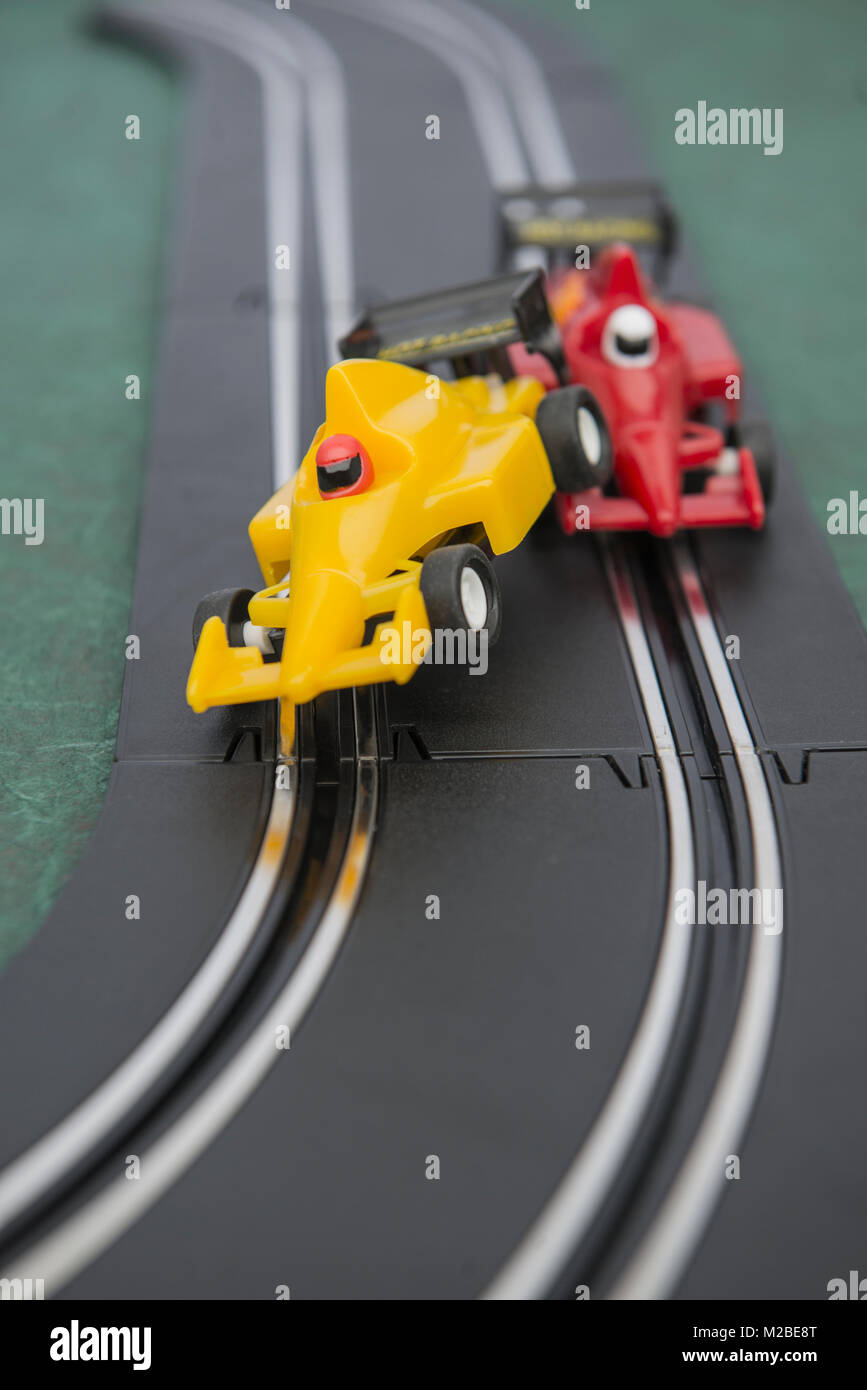 Cars on the track of a slot car racing game Stock Photo