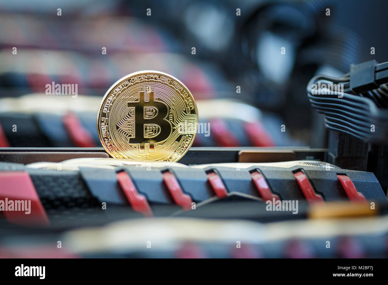 Golden metal coin as symbolic version of Bitcoin cryptocurrency on a ...