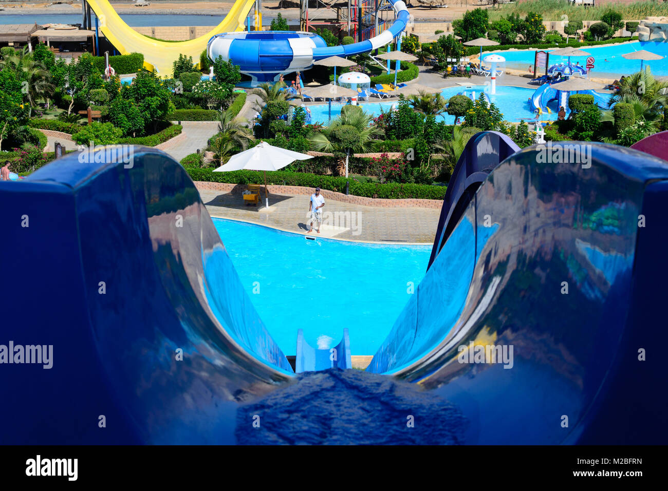 Waterpark slides with a swimming pool photo Stock Photo