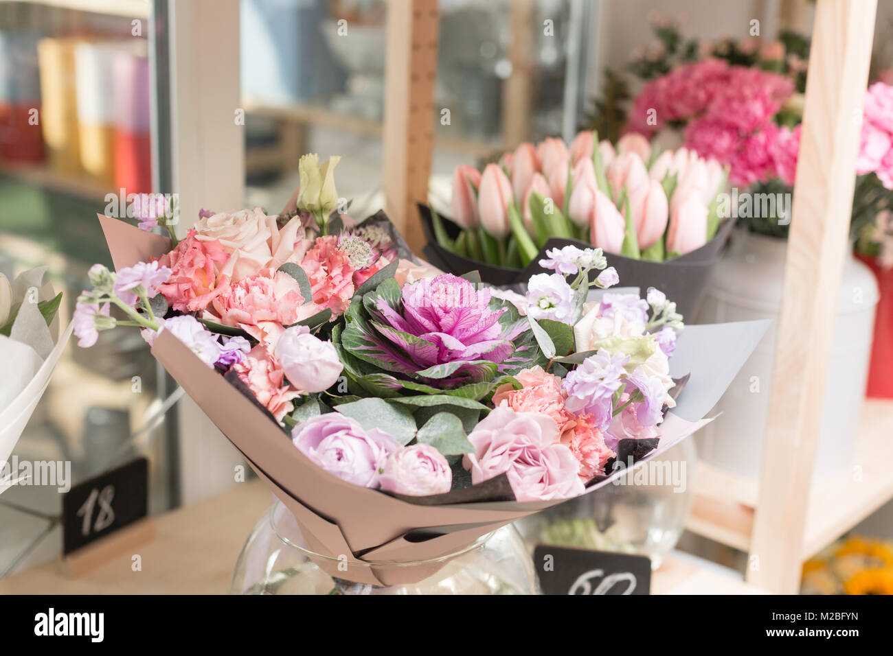 Flower shop concept. Different varieties fresh spring flowers in