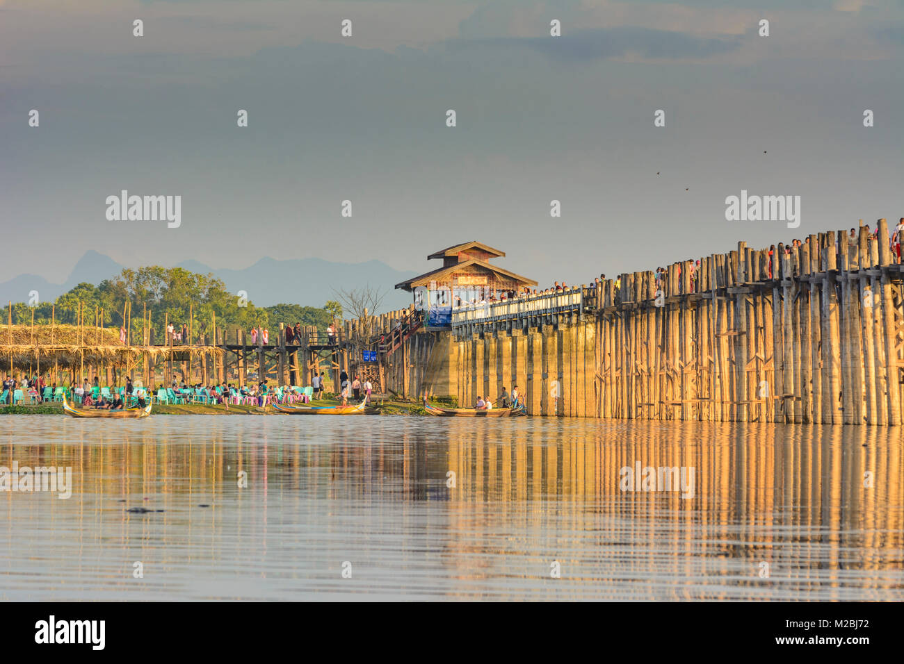 Amarapura: U-Bein Bridge teak footbridge, Taungthaman Lake, boats, , Mandalay Region, Myanmar (Burma) Stock Photo