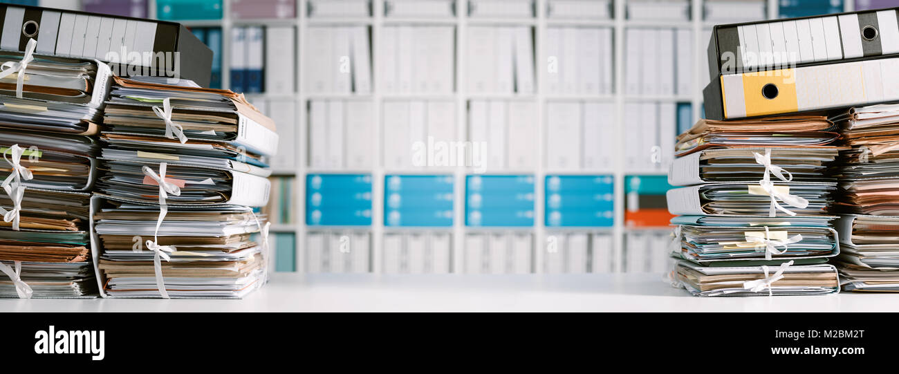 Stacks of files and paperwork in the office and bookshelves on the