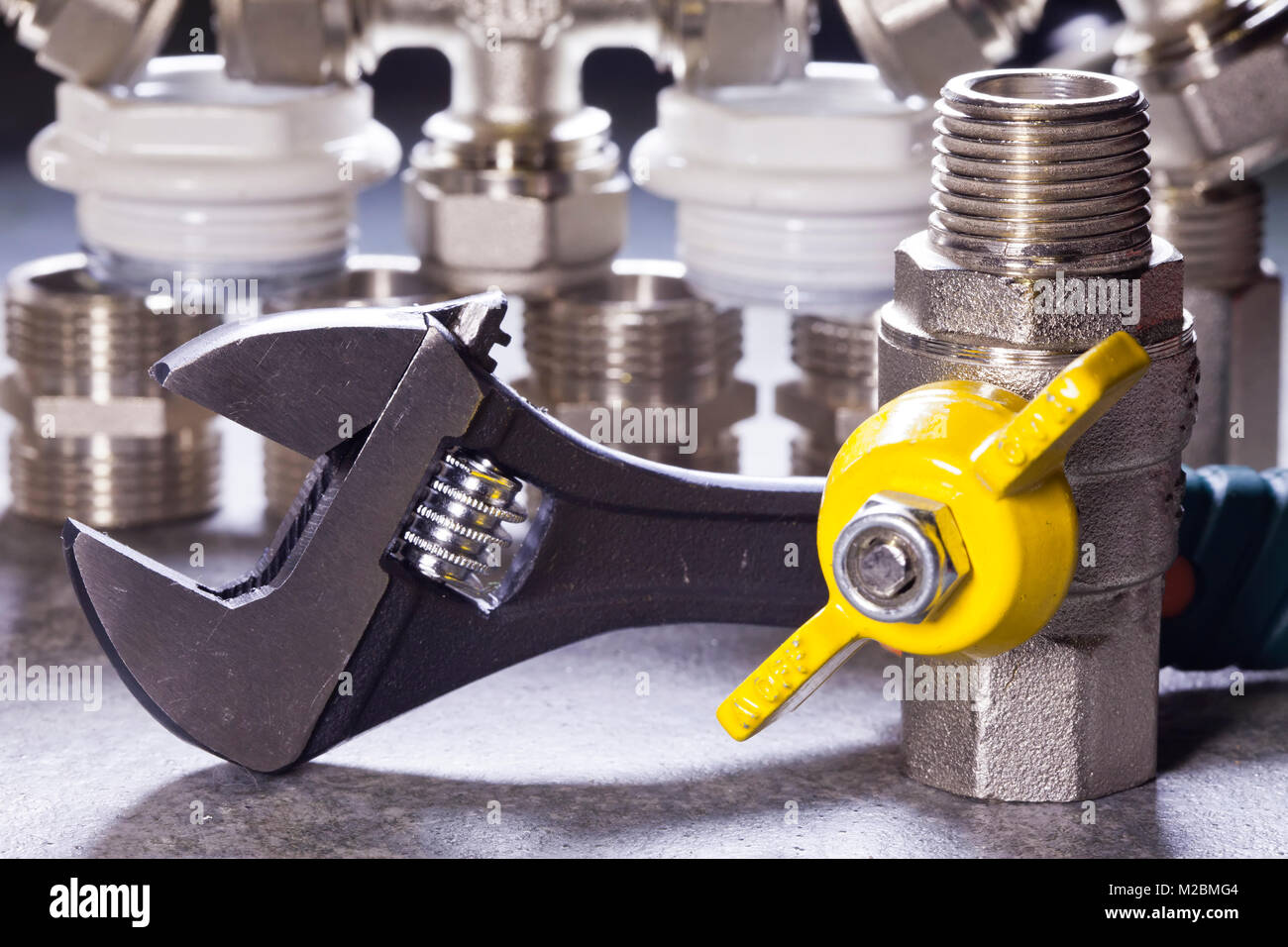 Adjust wrench power grip and elements of water and gas shutoff valves