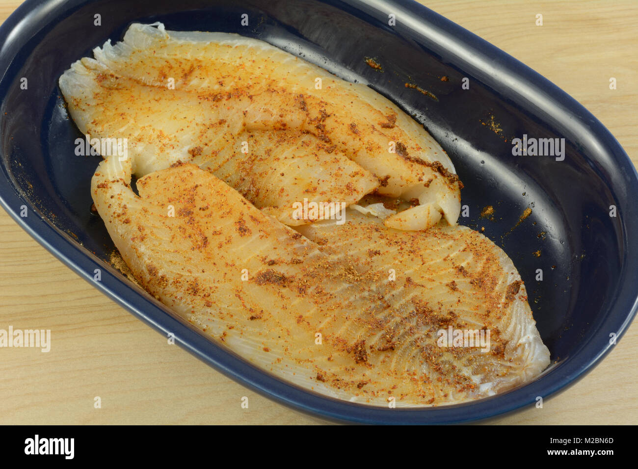Close up of fresh raw tilapia fish fillets prepared for cooking with