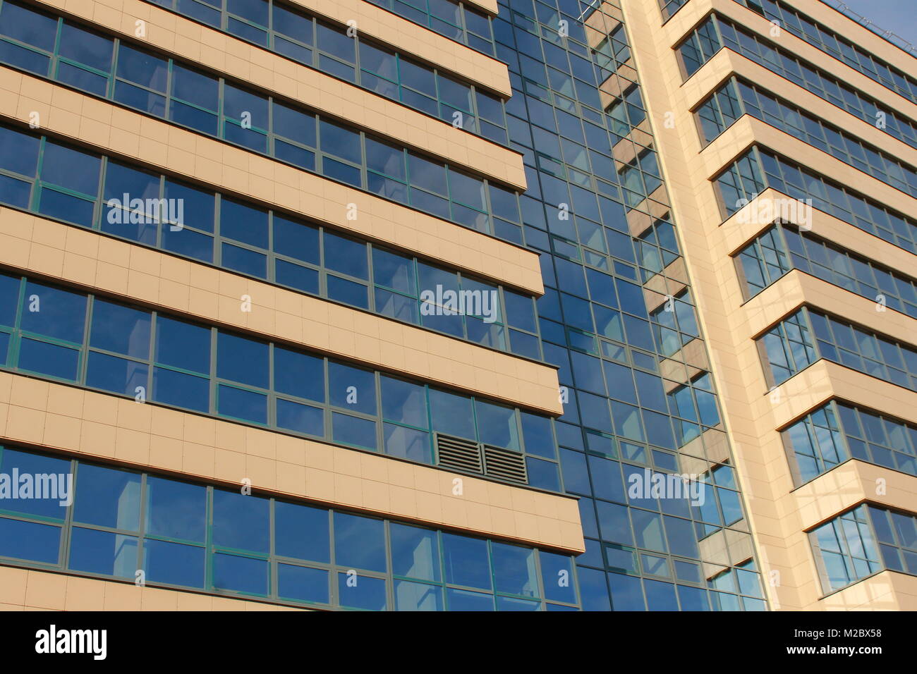 Modern office building wall made of blue glass and steel frame, background texture Stock Photo