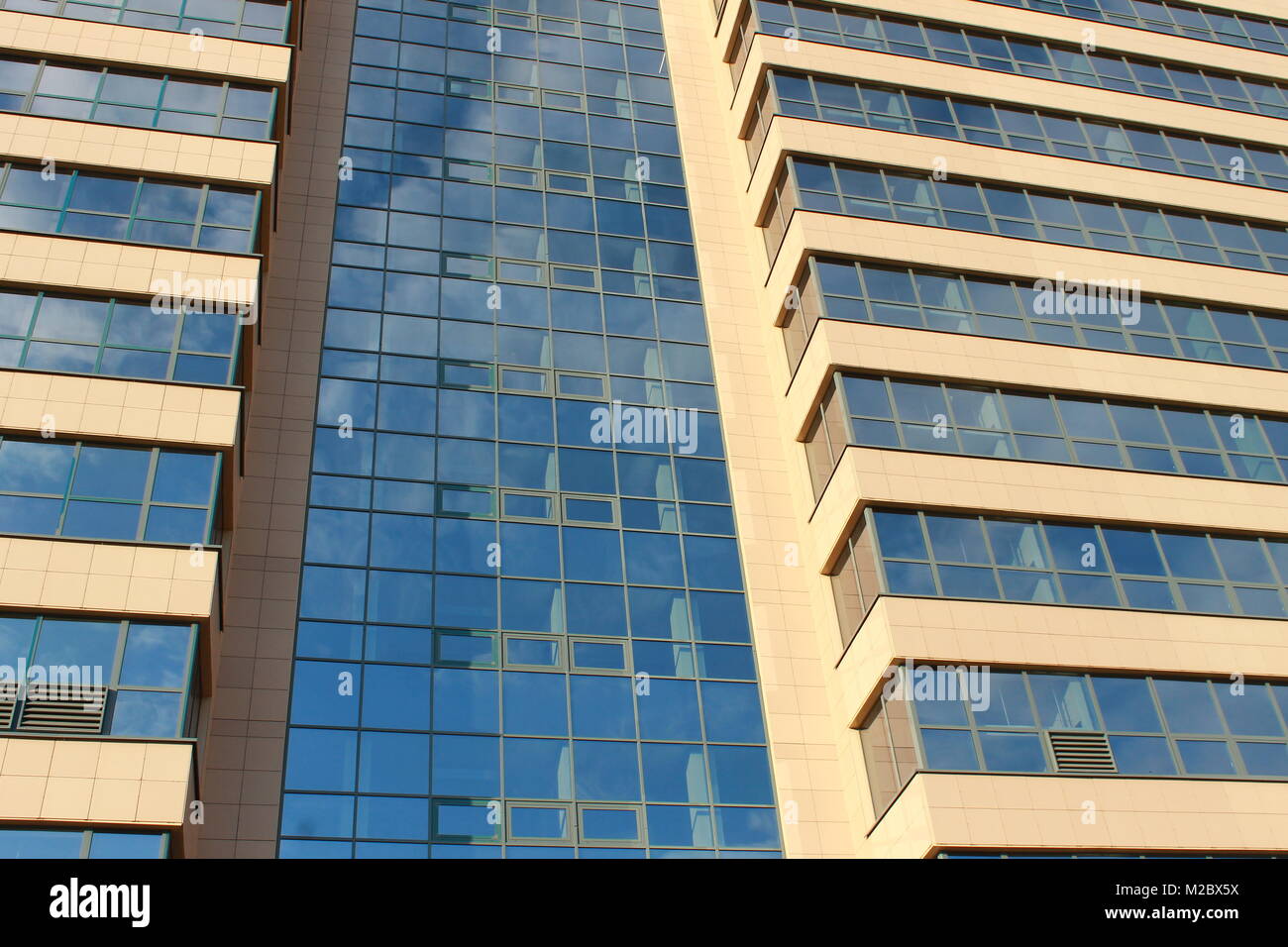 Modern office building wall made of blue glass and steel frame, background texture Stock Photo