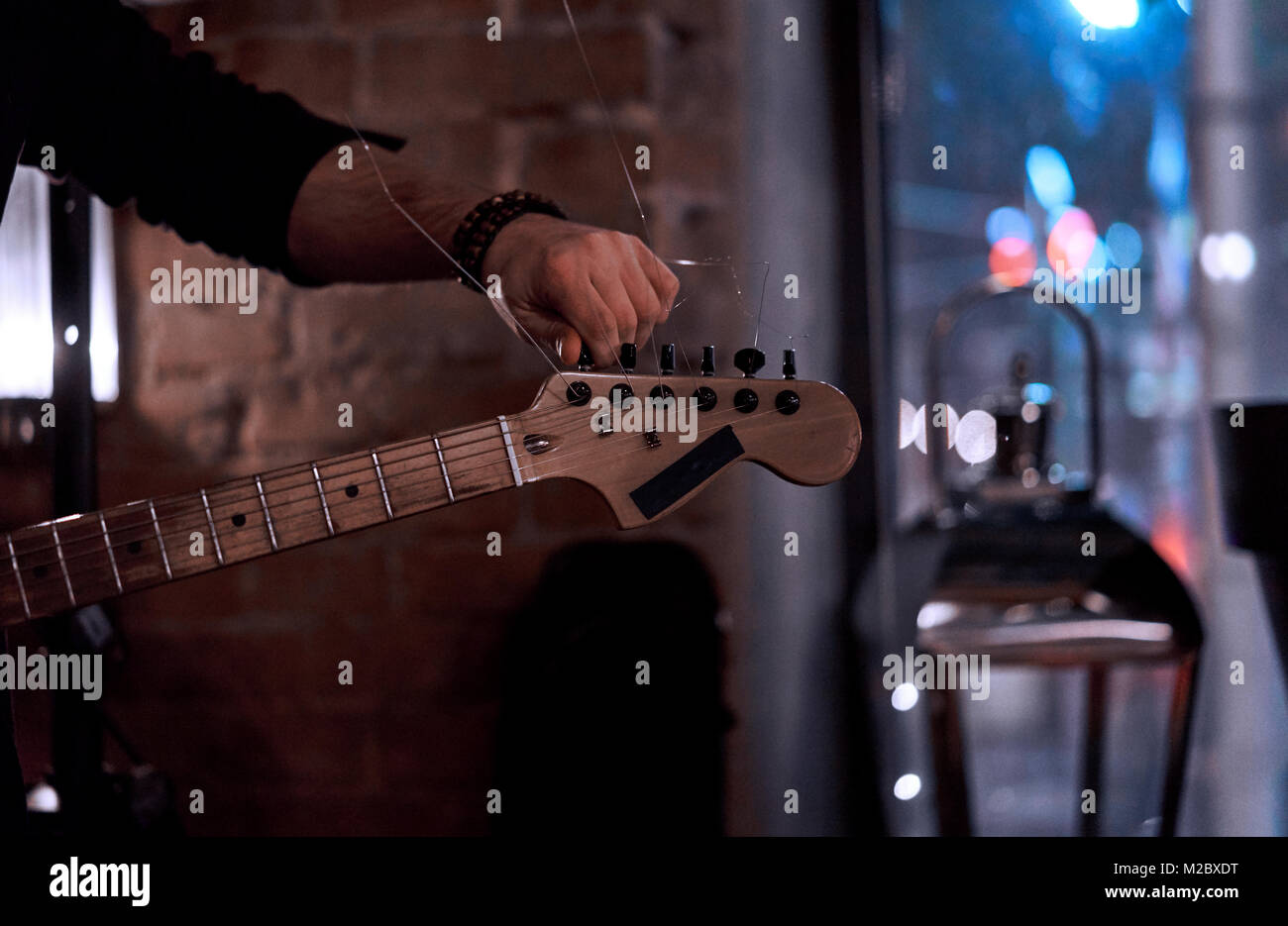 Musician plays electric guitar in hi-res stock photography and images