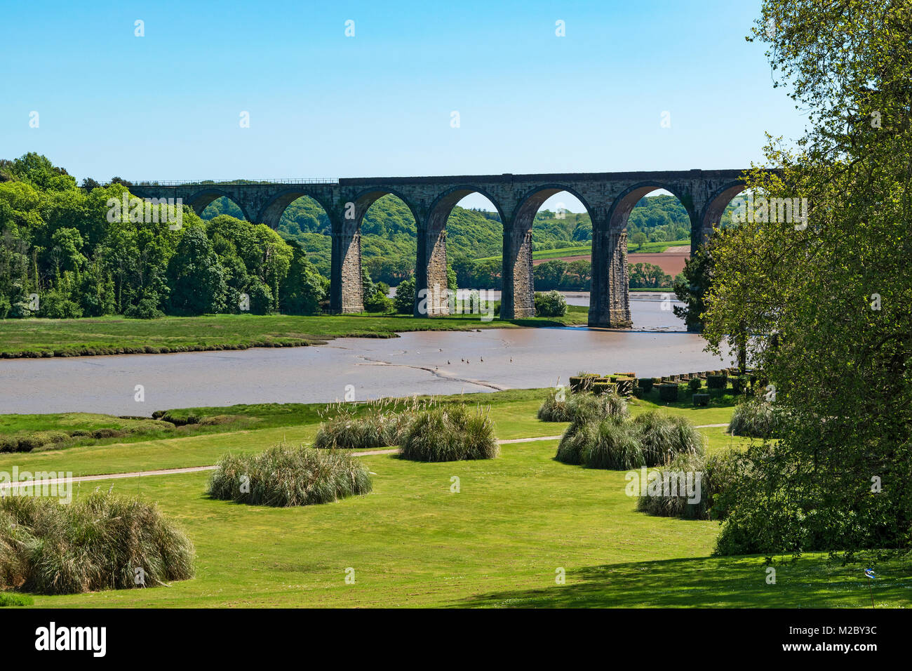 st.germans viaduct that takes the trains from cornwall to devon over the river tiddy viewed from the port eliot estate in cornwall, england, uk. Stock Photo