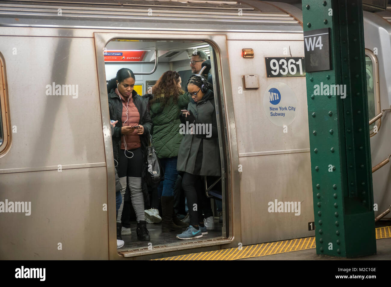 Put upon travelers over the weekend pile into a waiting subway train in New York Saturday, February 3, 2018.    (Â© Richard B. Levine) Stock Photo