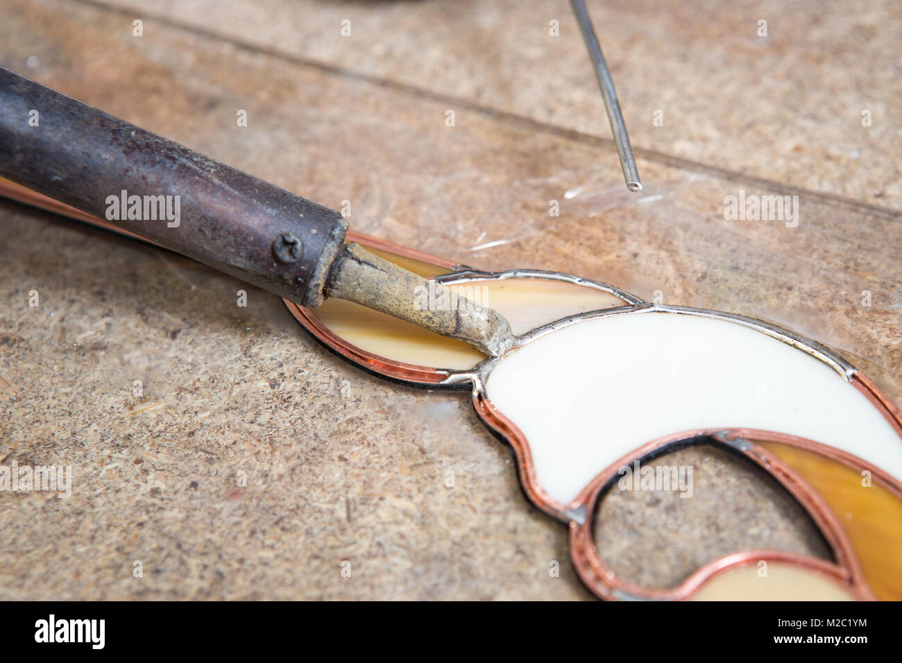 Stained glass maker works with colorful souvenirs Stock Photo Alamy