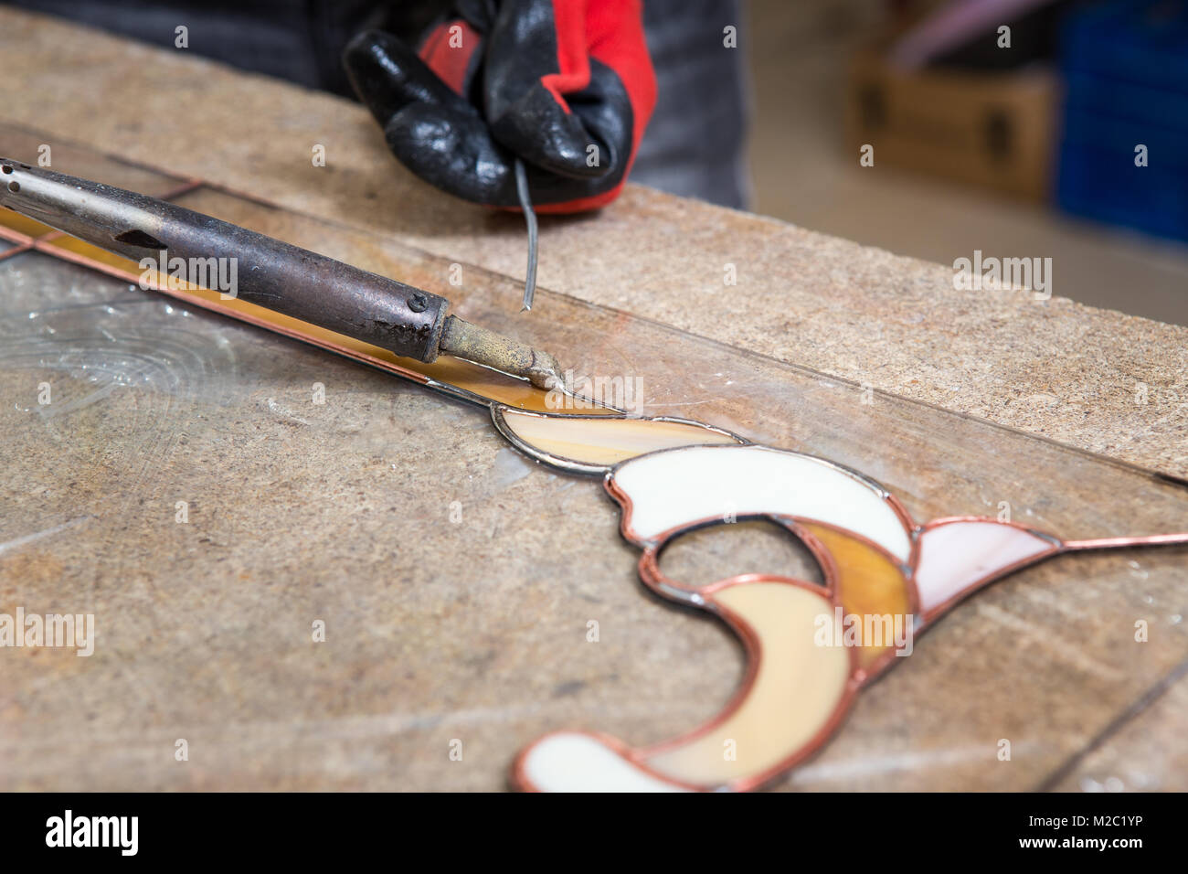 Stained glass maker works with colorful souvenirs Stock Photo Alamy