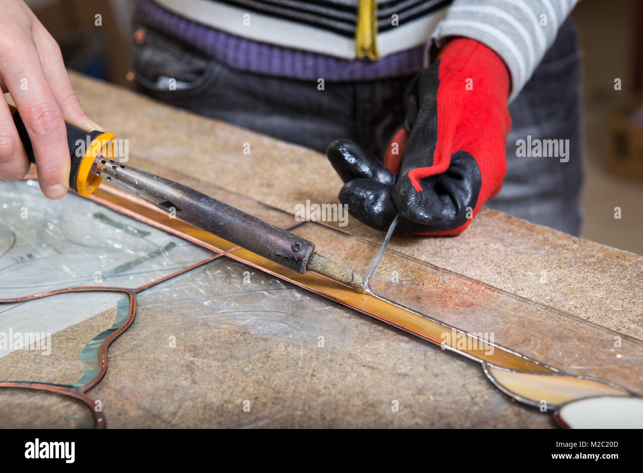 Stained glass maker works with colorful souvenirs Stock Photo Alamy