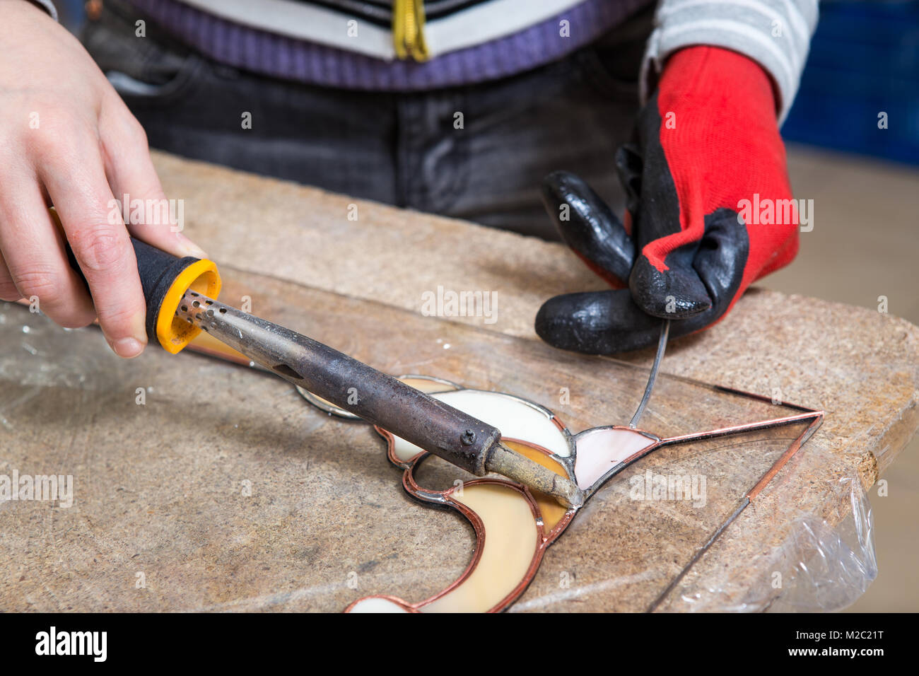 Stained glass maker works with colorful souvenirs Stock Photo Alamy