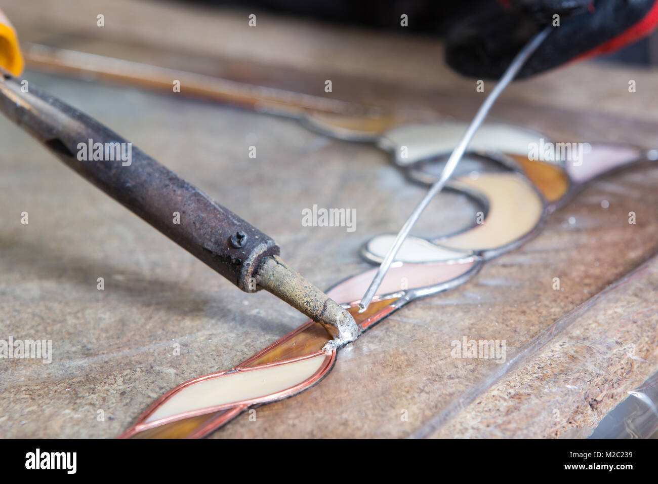 Stained glass maker works with colorful souvenirs Stock Photo Alamy