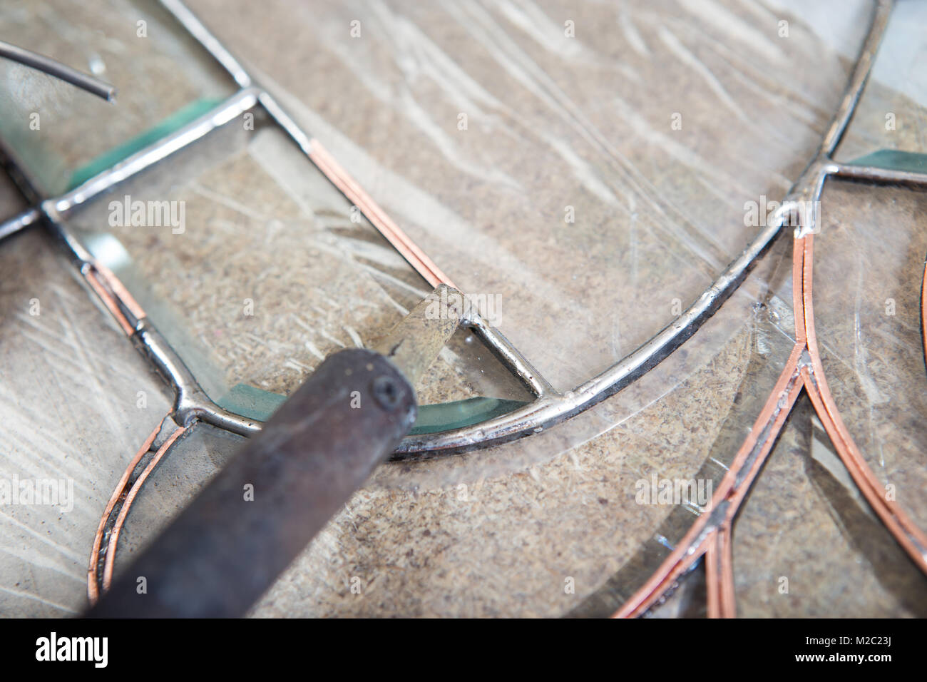 Stained glass maker works with colorful souvenirs Stock Photo Alamy