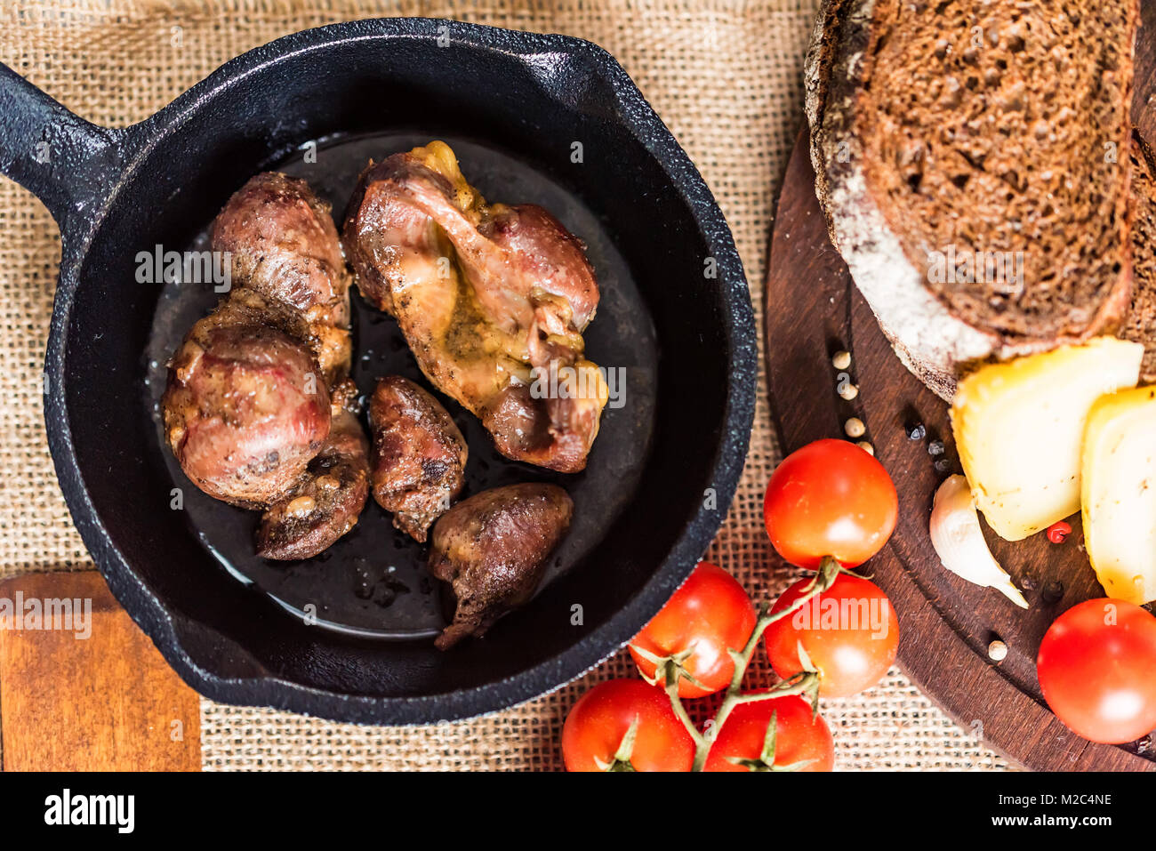 Top view roasted chicken giblets in pan and bread Stock Photo Alamy