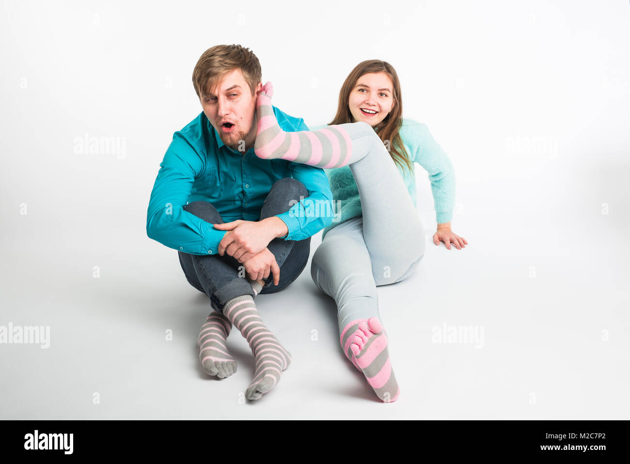 Portrait funny moments of excited couple fooling around to camera on ...