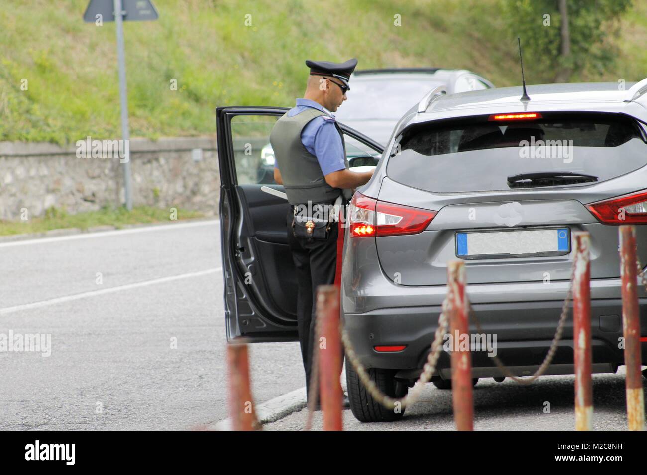 Italian special military police force carabinier controlling car on the road Stock Photo